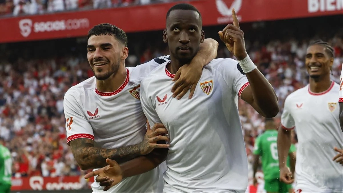 The Sevilla players celebrate a goal