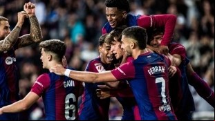 The Barcelona players celebrate a goal.